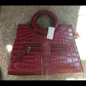 Red circle handle handbag